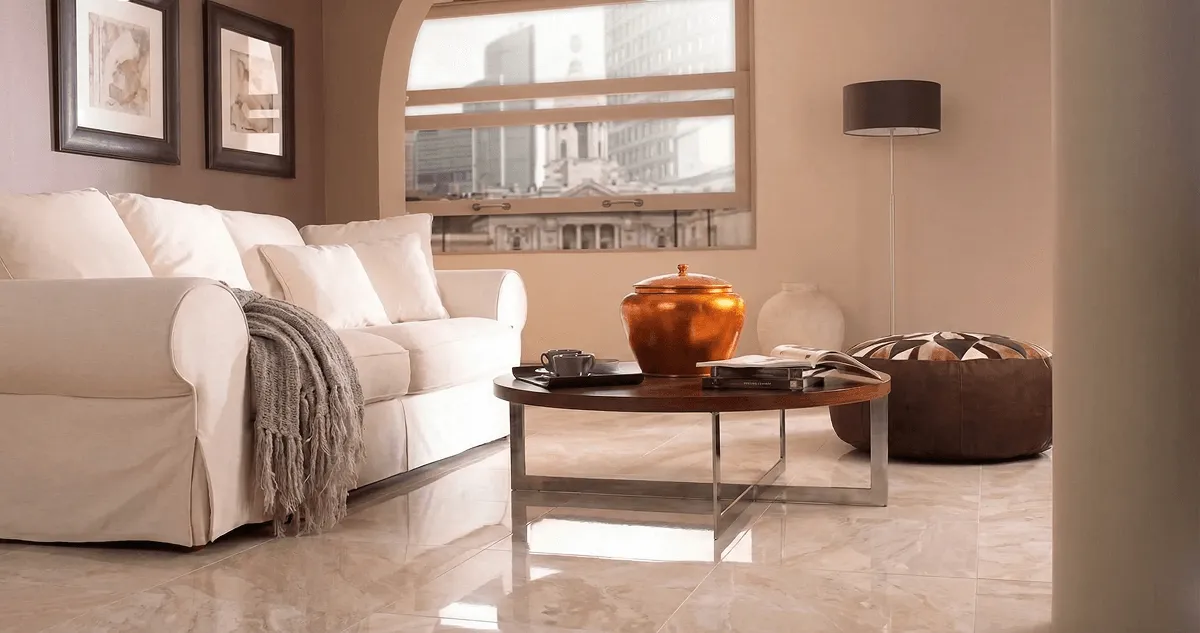 Modern living room with professionally installed marble flooring, a beige sofa, coffee table in Reno, NV